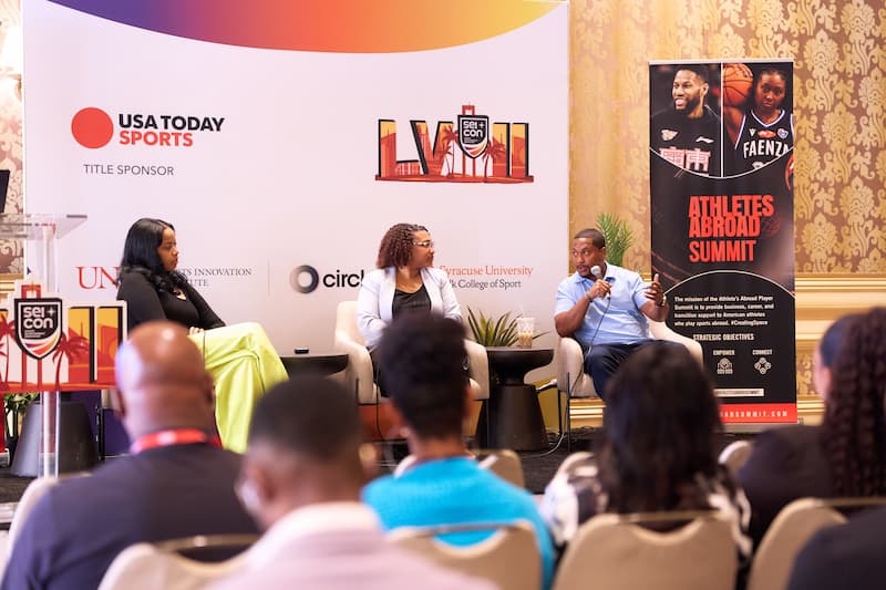 Athletes Abroad Summit Press Kit Panel discussion at Athletes Abroad Summit 2025 with USA Today Sports title sponsor branding
