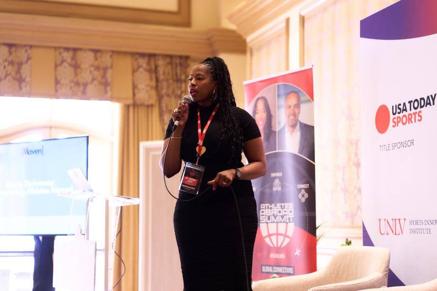 Athletes Abroad Summit Press Kit Speaker on stage, Athletes Abroad Summit 2025